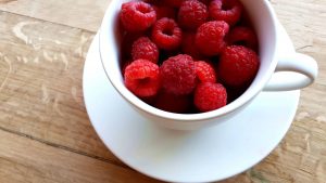 raspberries in a cup
